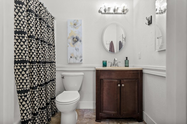 bathroom with vanity, toilet, and a shower with curtain