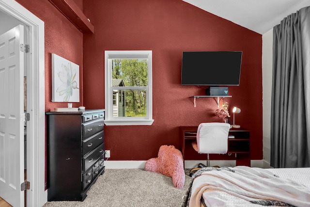 carpeted bedroom with vaulted ceiling