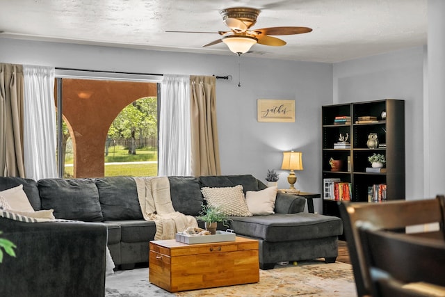 living room featuring ceiling fan