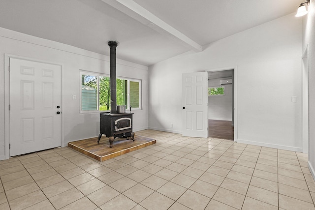 1331 Harpole Rd Unit A, Redding, CA 96002 - entryway with plenty of natural light, a wood stove, beam ceiling, and light tile patterned floors