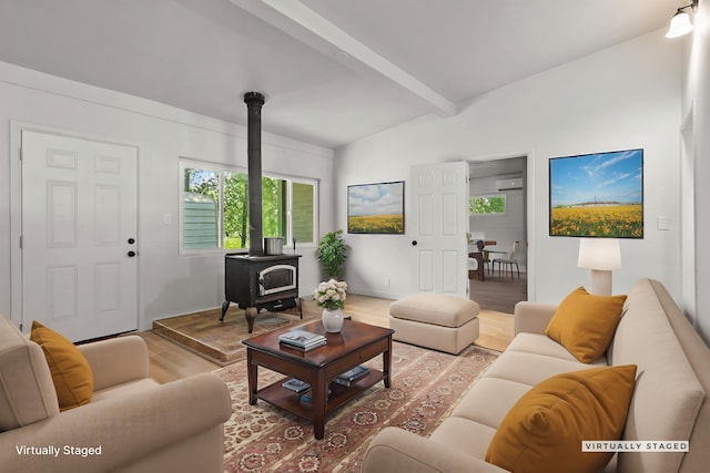 1331 Harpole Rd Unit A, Redding, CA 96002 - living area with beamed ceiling, wood finished floors, and a wood stove
