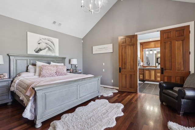 15320 Middletown Park Dr, Redding, CA 96001 - bedroom with high vaulted ceiling, a chandelier, dark wood-style flooring, and connected bathroom