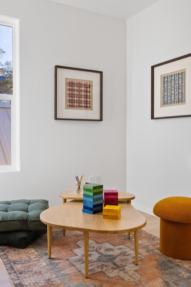 living area featuring baseboards