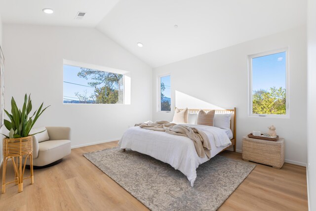 bedroom featuring recessed lighting, lofted ceiling, visible vents, and light wood-type flooring