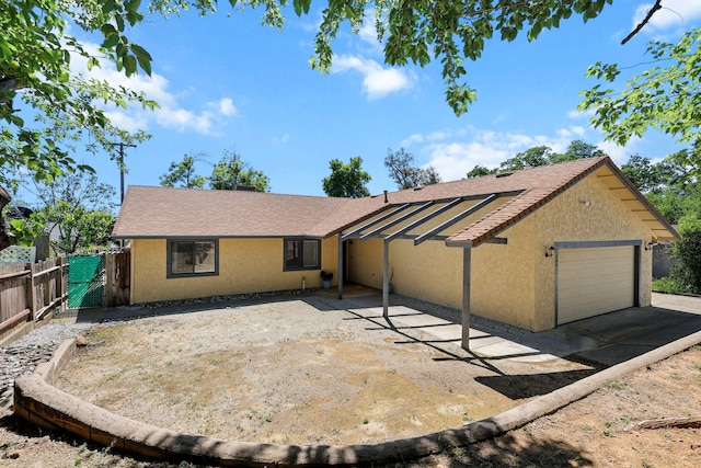 2831 Camulos Way, Redding, CA 96002 - ranch-style home with a garage, concrete driveway, stucco siding, and fence