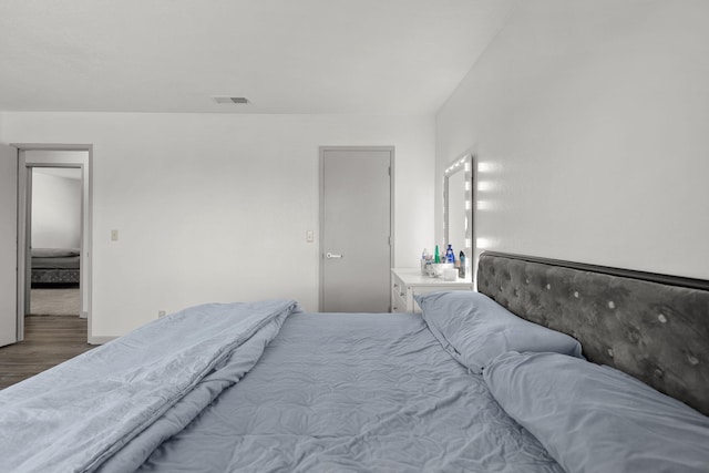 2831 Camulos Way, Redding, CA 96002 - bedroom featuring wood finished floors, visible vents, and baseboards