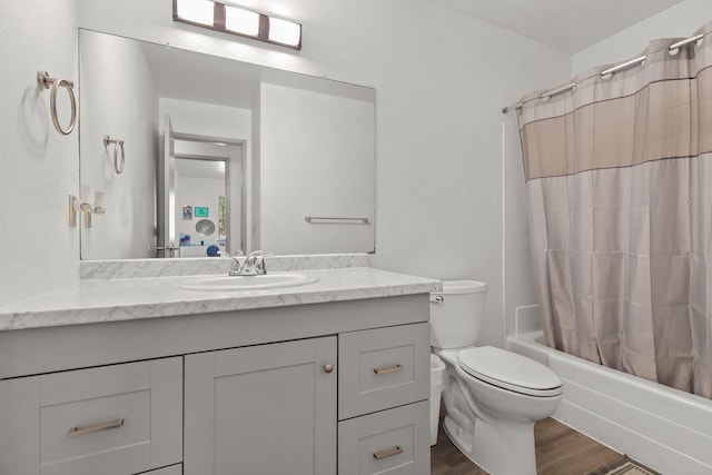 2831 Camulos Way, Redding, CA 96002 - full bathroom featuring wood finished floors, toilet, vanity, and shower / bathtub combination with curtain
