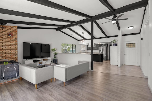 2831 Camulos Way, Redding, CA 96002 - living room with lofted ceiling with beams, baseboards, ceiling fan, and light wood-type flooring