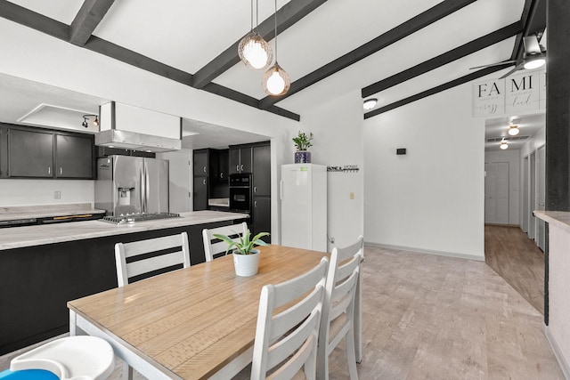 2831 Camulos Way, Redding, CA 96002 - dining room with ceiling fan, baseboards, vaulted ceiling with beams, and light wood-style flooring