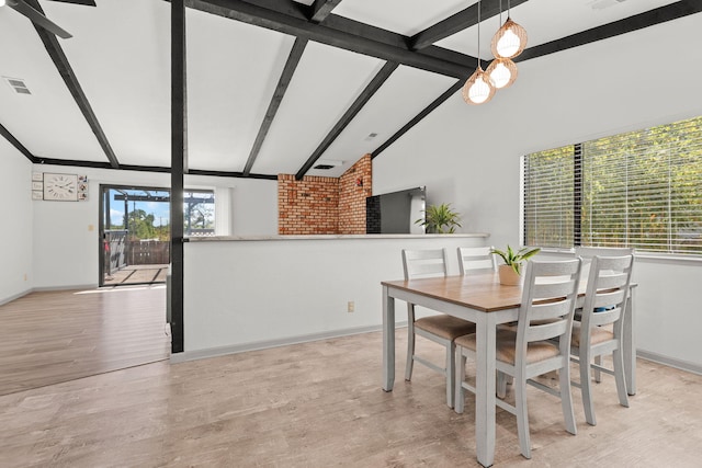 2831 Camulos Way, Redding, CA 96002 - dining area featuring light wood-type flooring, vaulted ceiling with beams, baseboards, and visible vents