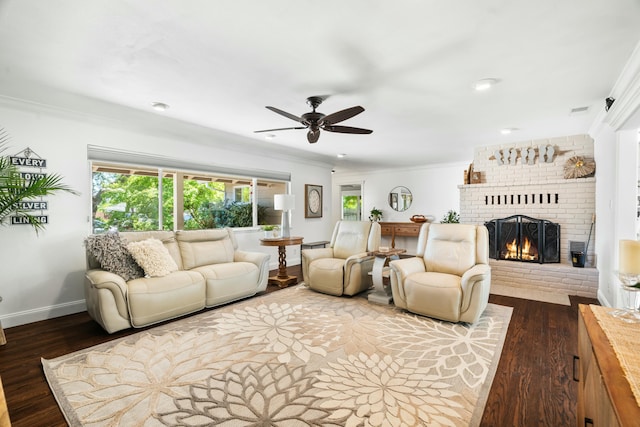 6860 Riata Dr, Redding, CA 96002 - living area featuring dark wood-style floors, baseboards, a brick fireplace, ceiling fan, and ornamental molding