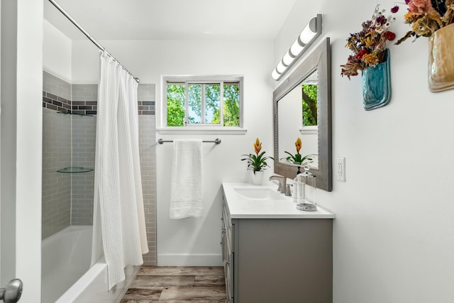 6860 Riata Dr, Redding, CA 96002 - bathroom with shower / tub combo, vanity, and wood finished floors