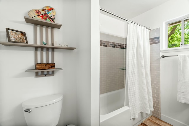6860 Riata Dr, Redding, CA 96002 - full bathroom with toilet, wood finished floors, and shower / bathtub combination with curtain