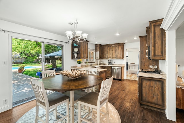 6860 Riata Dr, Redding, CA 96002 - dining area featuring baseboards, dark wood-style floors, recessed lighting, and a notable chandelier