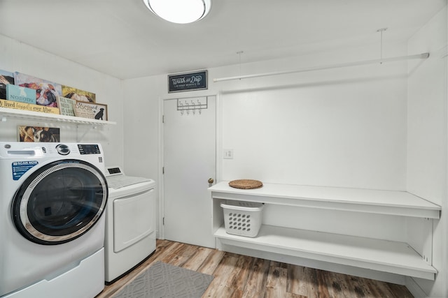 6860 Riata Dr, Redding, CA 96002 - laundry area with separate washer and dryer, laundry area, and light wood-style flooring