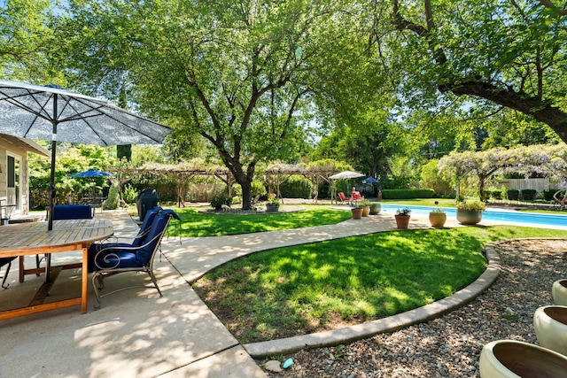 6860 Riata Dr, Redding, CA 96002 - view of yard featuring a fenced in pool, a patio area, outdoor dining area, and fence