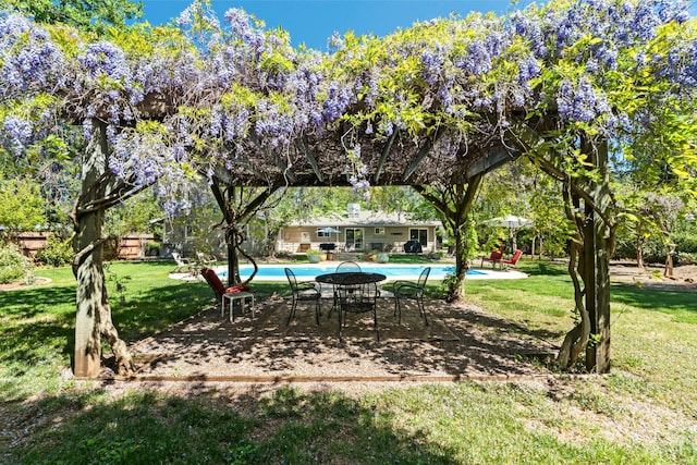 6860 Riata Dr, Redding, CA 96002 - view of home's community featuring a pool, a lawn, and a patio