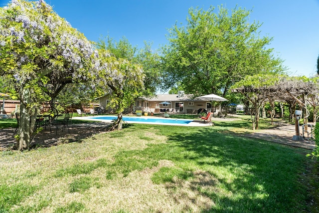 6860 Riata Dr, Redding, CA 96002 - view of yard featuring fence and an outdoor pool
