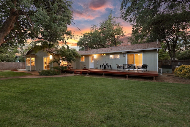 7057 Riata Dr, Redding, CA 96002 - rear view of house with a deck and a chimney