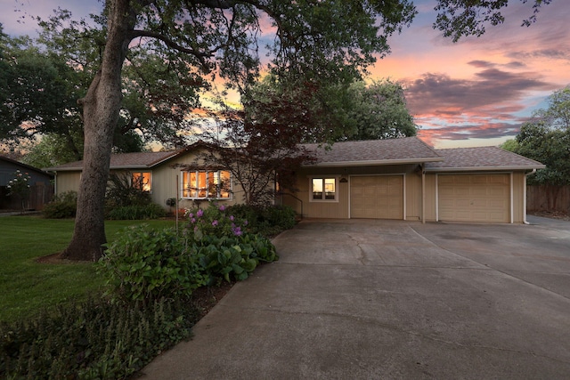 7057 Riata Dr, Redding, CA 96002 - ranch-style home with a garage, driveway, and roof with shingles