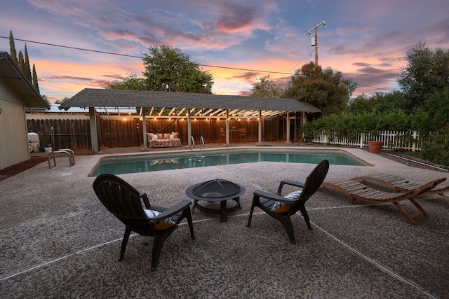 7057 Riata Dr, Redding, CA 96002 - view of pool featuring a fire pit, a fenced backyard, and a patio area