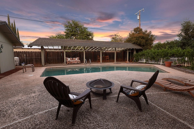 7057 Riata Dr, Redding, CA 96002 - view of pool featuring an outdoor fire pit, a fenced backyard, and a patio area