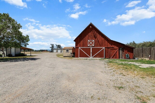 4647 County Road Ff, Orland, CA 95963 - view of barn featuring fence and a carport