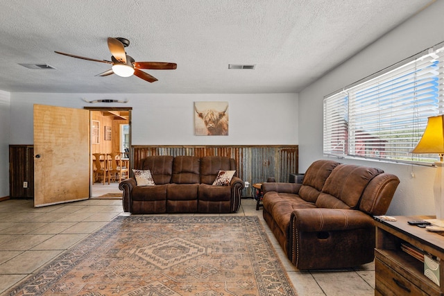4647 County Road Ff, Orland, CA 95963 - living room with a textured ceiling, light tile patterned flooring, and ceiling fan