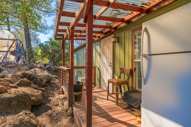 wooden terrace with a pergola