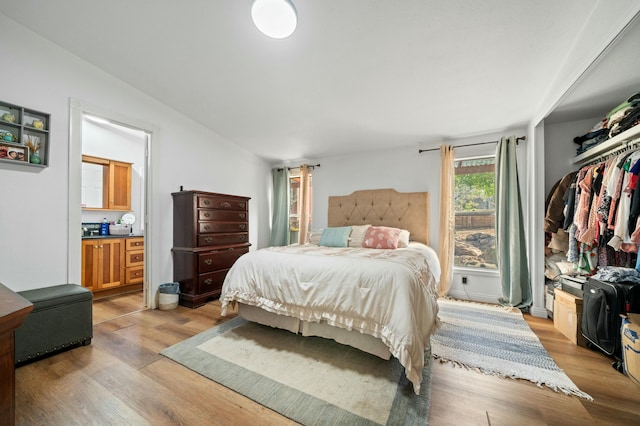 bedroom with light wood-style floors