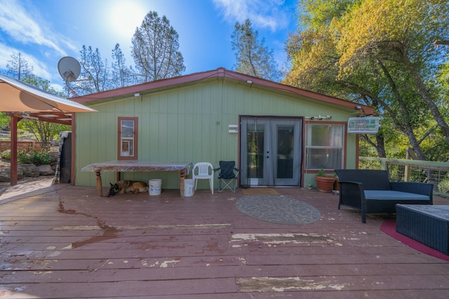 deck with an outdoor hangout area and french doors