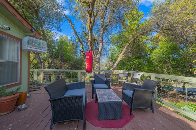 wooden deck with an outdoor living space