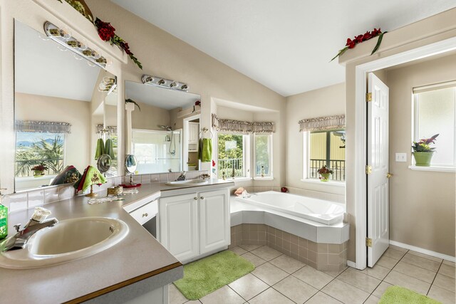 21623 Seven Lakes Ln, Redding, CA 96003 - full bath featuring lofted ceiling, a garden tub, tile patterned flooring, and vanity