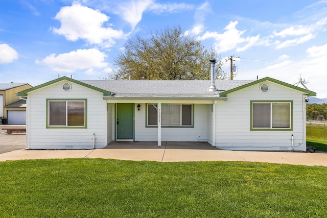 21623 Seven Lakes Ln, Redding, CA 96003 - ranch-style home featuring a front lawn, a patio area, and a shingled roof