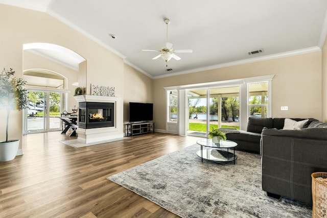 21623 Seven Lakes Ln, Redding, CA 96003 - living area with lofted ceiling, plenty of natural light, a ceiling fan, and wood finished floors