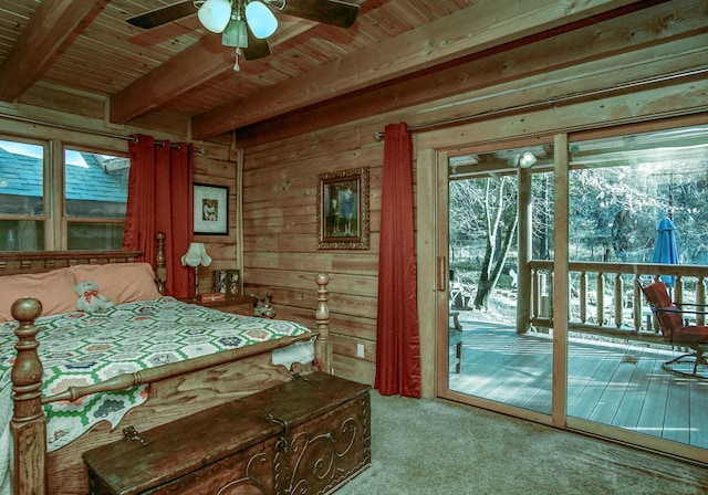 carpeted bedroom with wooden walls, access to exterior, wooden ceiling, beam ceiling, and ceiling fan