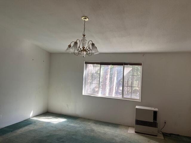 8725 Rocky Mountain Rd, Shingletown, CA 96088 - interior space with carpet flooring, a chandelier, and heating unit