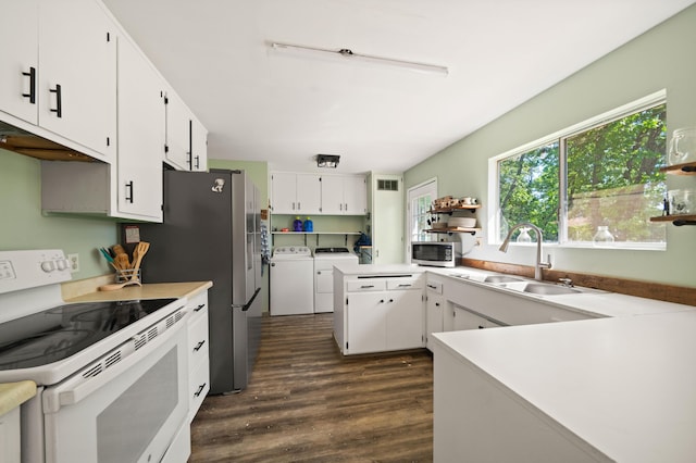 kitchen with open shelves, a sink, white electric range oven, stainless steel microwave, and washer and dryer