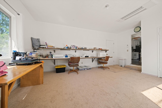 office space with a ceiling fan and carpet flooring
