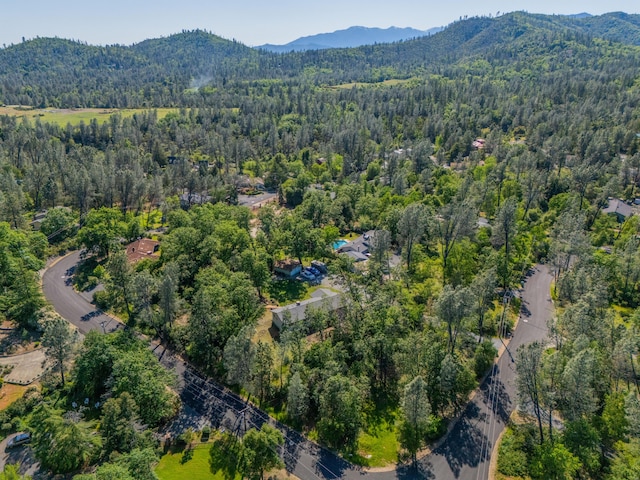 aerial view featuring a mountain view and a wooded view