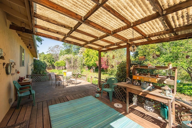 wooden deck with outdoor dining space