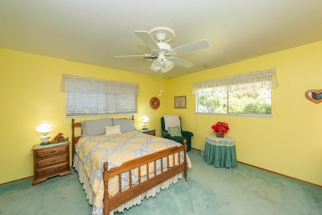 bedroom featuring baseboards, a ceiling fan, and carpet flooring