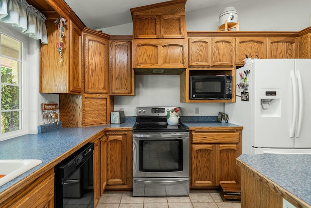kitchen with brown cabinetry and black appliances