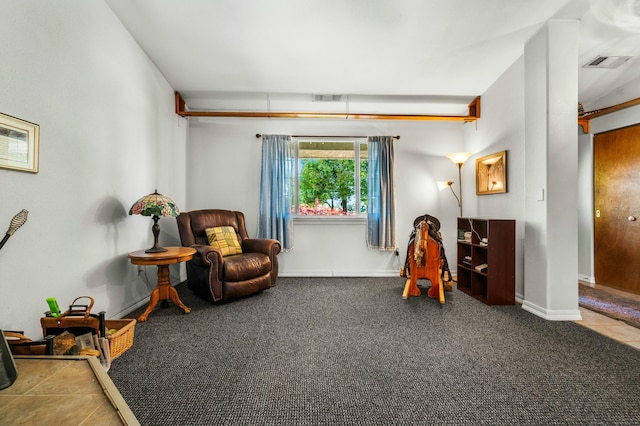 sitting room with baseboards, visible vents, and carpet floors