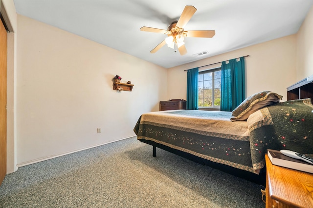 bedroom featuring visible vents, carpet floors, and ceiling fan