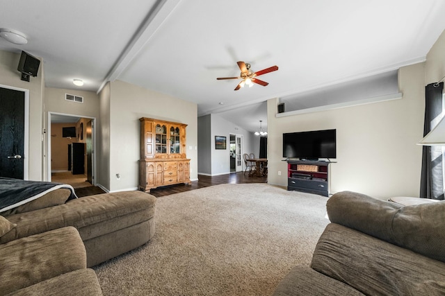 living area with visible vents, carpet flooring, baseboards, and a ceiling fan