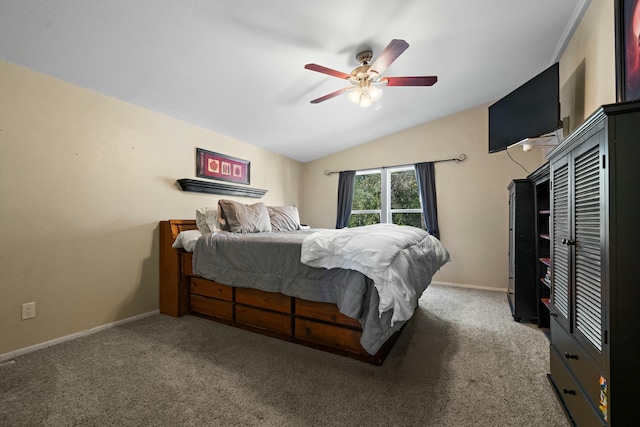 bedroom with ceiling fan, lofted ceiling, carpet flooring, and baseboards