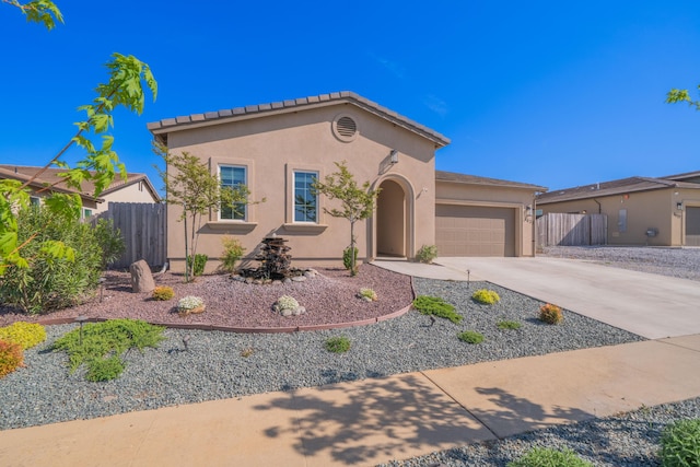 4631 Pleasant Hills Dr, Anderson, CA 96007 - mediterranean / spanish house with a garage, concrete driveway, stucco siding, and fence