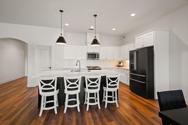 4631 Pleasant Hills Dr, Anderson, CA 96007 - kitchen with tasteful backsplash, a sink, high quality fridge, stainless steel microwave, and white cabinetry