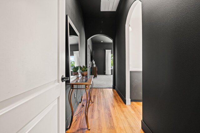 4631 Pleasant Hills Dr, Anderson, CA 96007 - hallway featuring light wood finished floors and arched walkways